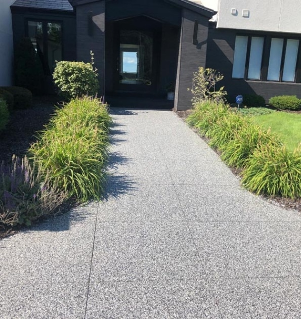 Concrete coated front walkway path.