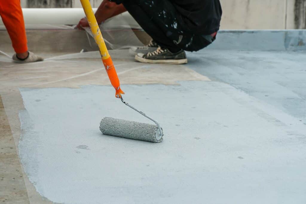 hand painting concrete flooring.